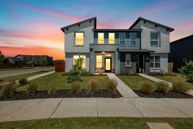 modern home featuring a yard