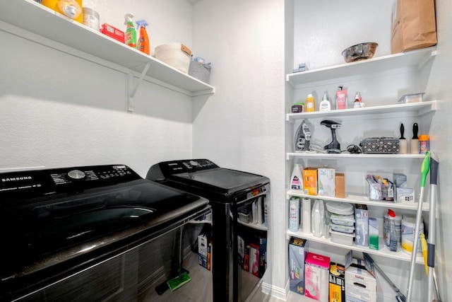 laundry area with separate washer and dryer