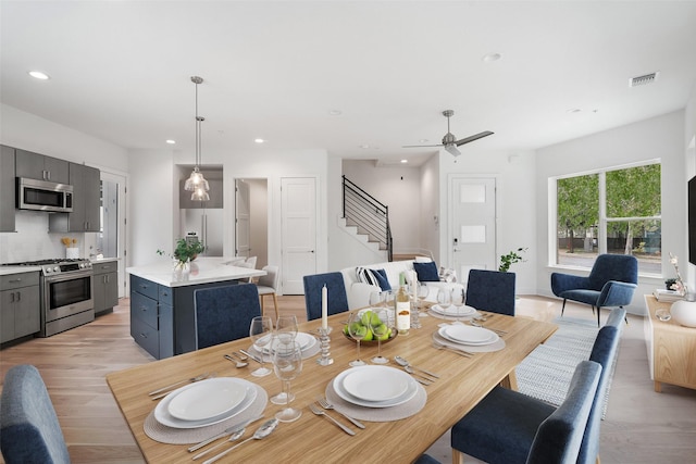 dining room featuring ceiling fan and light wood-type flooring