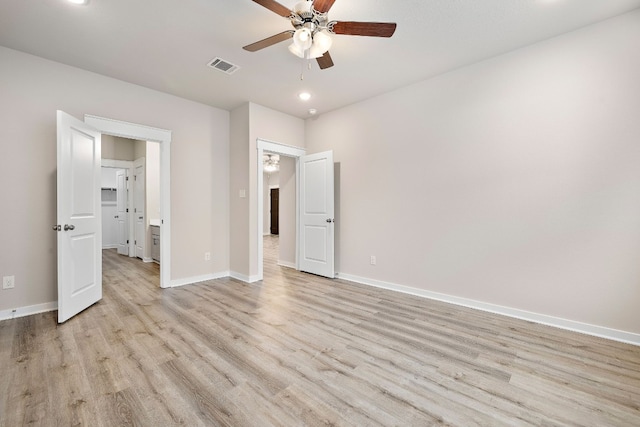 unfurnished bedroom with ceiling fan and light hardwood / wood-style flooring