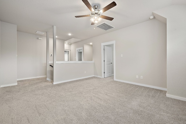 carpeted spare room featuring ceiling fan