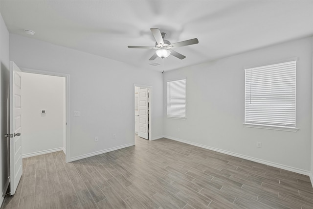 unfurnished room featuring ceiling fan and light wood-type flooring