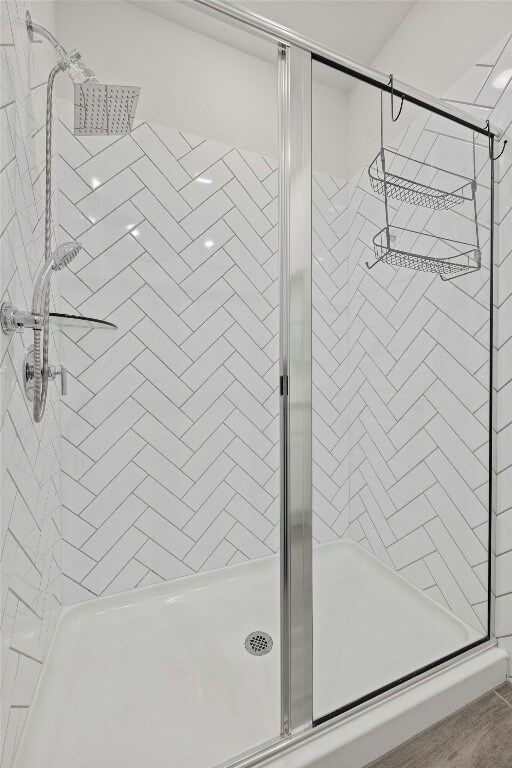 bathroom with tiled shower