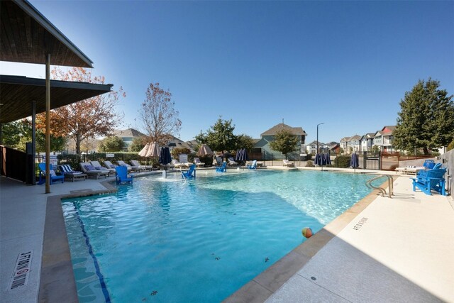 view of swimming pool with a patio area