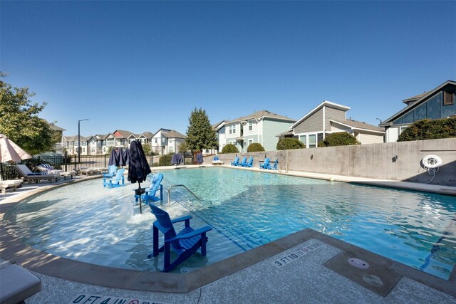 view of swimming pool with a patio