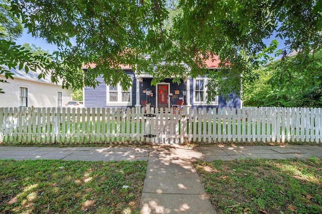 obstructed view of property with a front yard