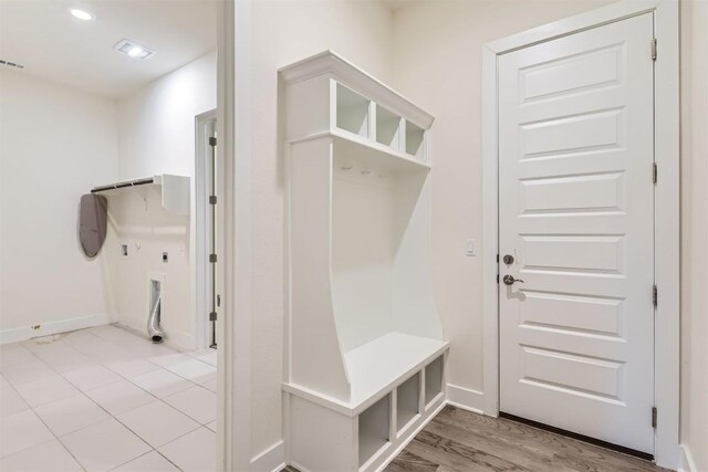 mudroom with wood-type flooring