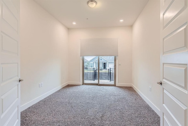 carpeted spare room with recessed lighting and baseboards