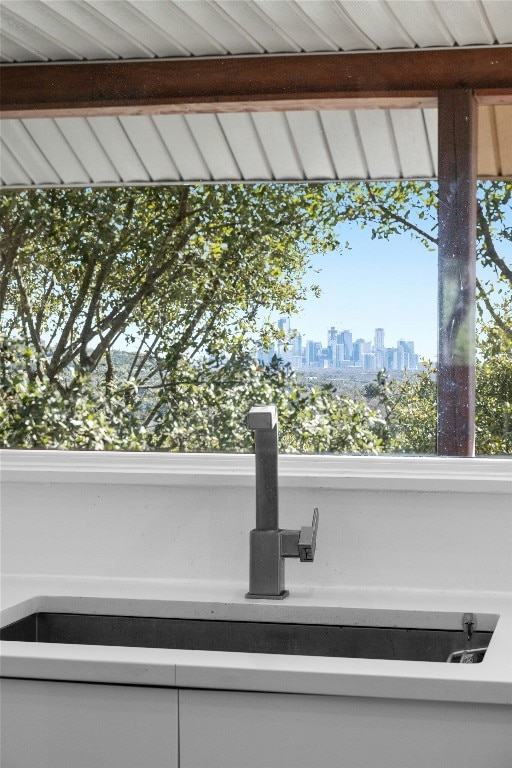 1603 Twilight Ridge Dr, Austin, TX 78746 - kitchen view of skyline and white cabinets