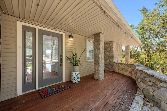 view of exterior entry with covered porch