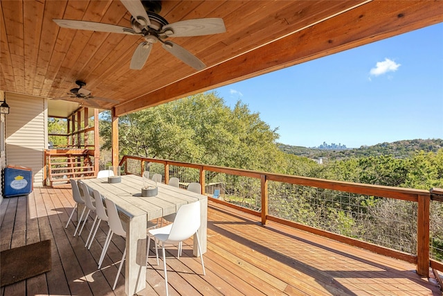 wooden terrace featuring ceiling fan