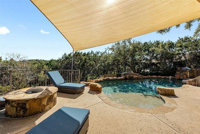 view of swimming pool with a patio