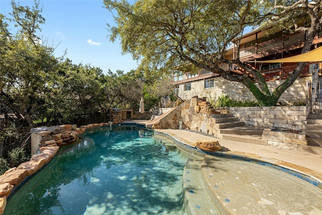 view of pool with a water slide