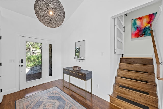 foyer featuring a high ceiling and dark hardwood / wood-style floors