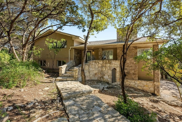 1603 Twilight Ridge Dr, Austin, TX 78746 - view of front of house with stone siding and stairway