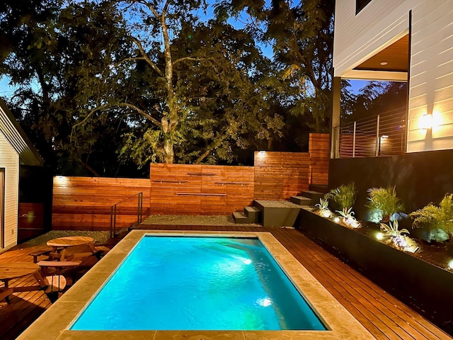 view of pool featuring a wooden deck