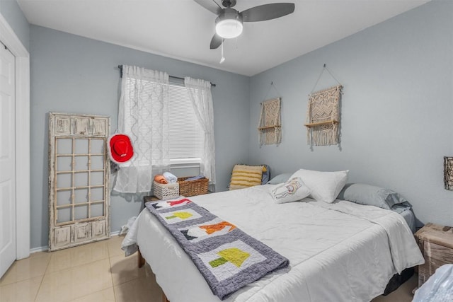 tiled bedroom with ceiling fan