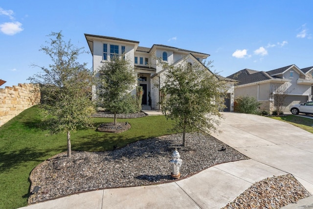 view of front facade with a front lawn and a garage