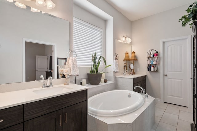 17820 Limestone Spring Ln, Austin, TX 78738 - full bathroom with a garden tub, two vanities, and tile patterned floors