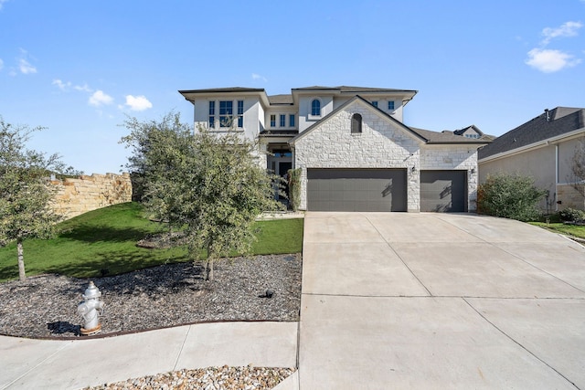 view of front of home featuring a front yard and a garage