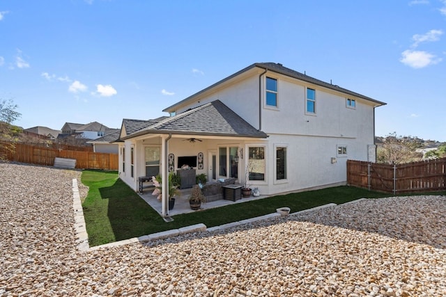 17820 Limestone Spring Ln, Austin, TX 78738 - back of house featuring ceiling fan, a patio, stucco siding, and roof with shingles
