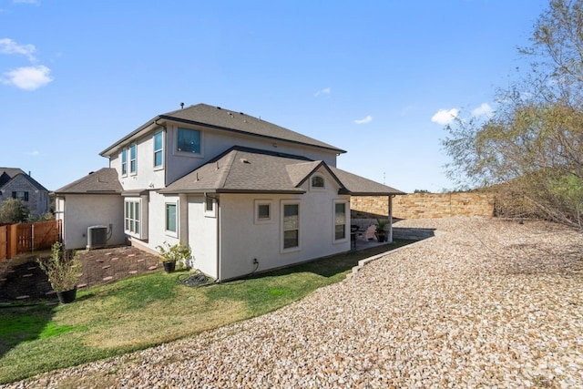17820 Limestone Spring Ln, Austin, TX 78738 - rear view of property featuring stucco siding, roof with shingles, and central AC unit