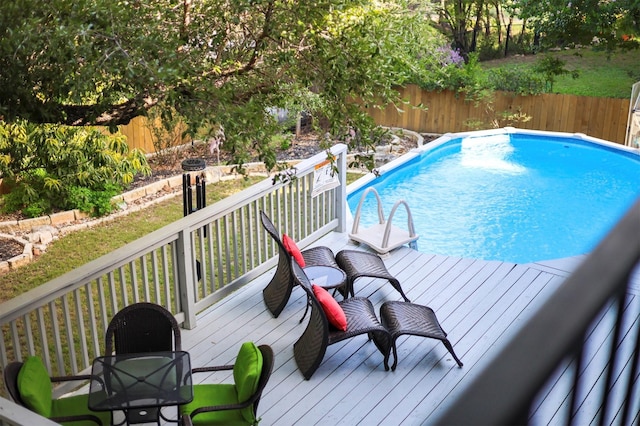 view of pool featuring a wooden deck