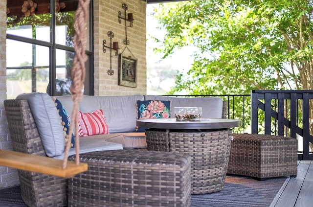 wooden terrace with an outdoor hangout area