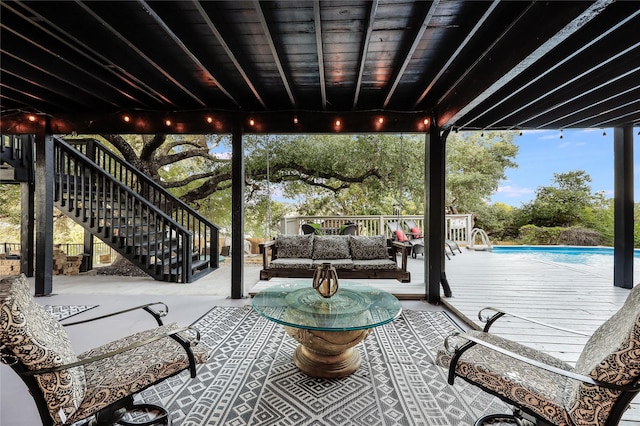 view of patio with an outdoor hangout area and a fenced in pool