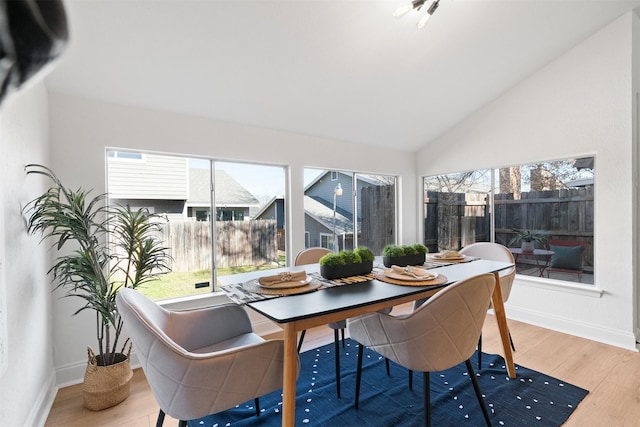 sunroom featuring lofted ceiling