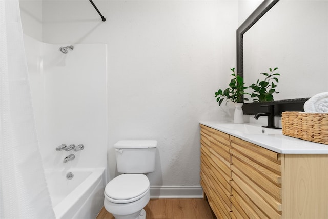 full bathroom with toilet, vanity, hardwood / wood-style floors, and shower / tub combo with curtain