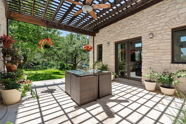 view of patio / terrace featuring french doors, ceiling fan, and a pergola