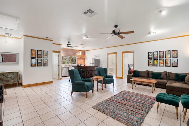 living room with ornamental molding, ceiling fan, and light tile patterned flooring