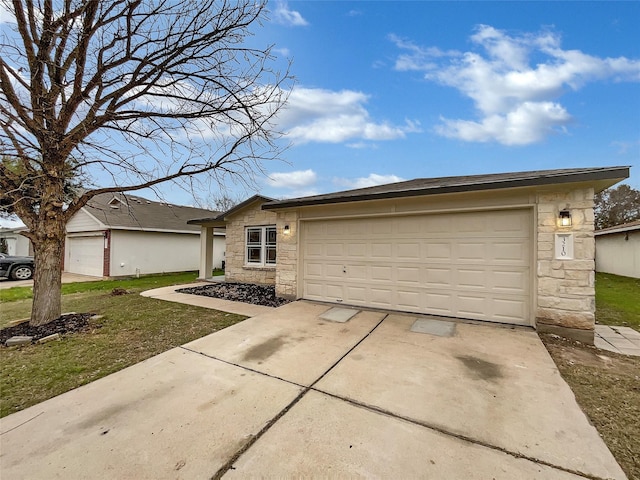 ranch-style home with a front lawn and a garage