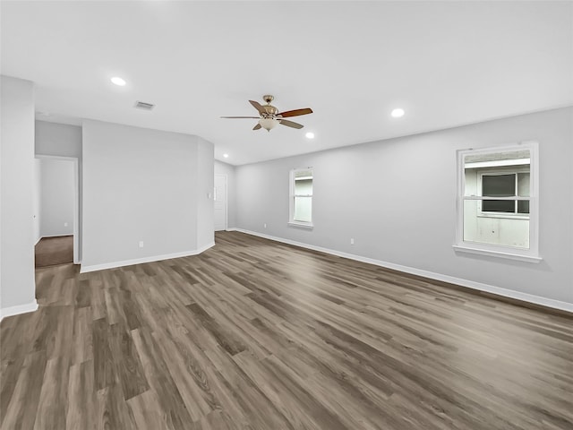 unfurnished room featuring ceiling fan and dark hardwood / wood-style flooring