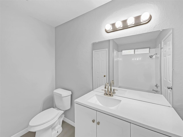 bathroom with toilet and vanity