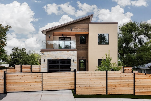 contemporary house with a balcony and ceiling fan