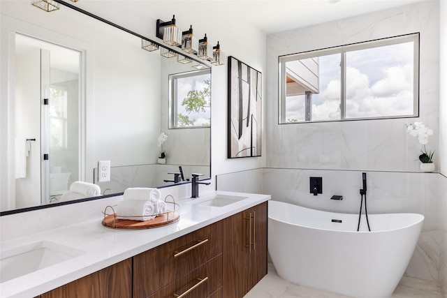 bathroom with a bathing tub and vanity