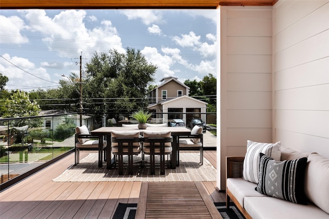 wooden terrace with outdoor lounge area