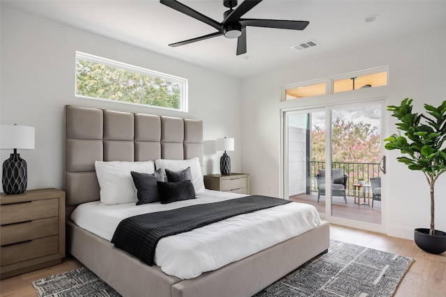 bedroom with hardwood / wood-style flooring, ceiling fan, and access to exterior