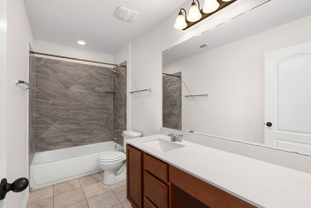 full bathroom with toilet, tiled shower / bath, tile patterned floors, and vanity