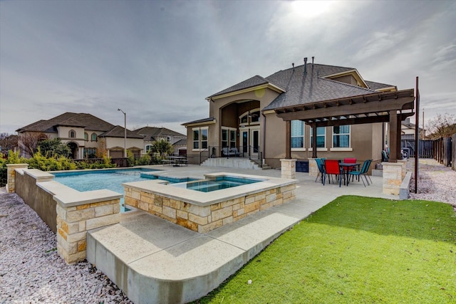 view of swimming pool with a patio and an in ground hot tub