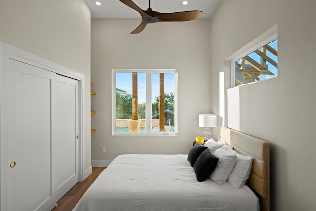 bedroom with hardwood / wood-style floors and ceiling fan