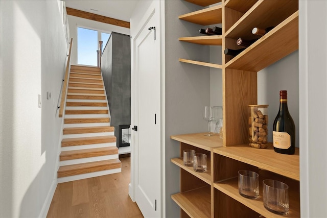 mudroom with light hardwood / wood-style flooring