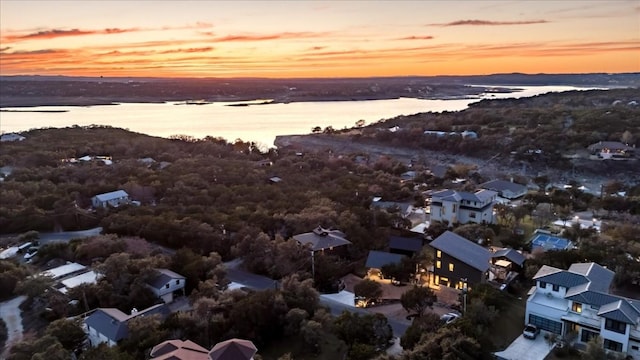 aerial view at dusk with a water view