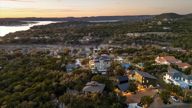 aerial view at dusk with a water view