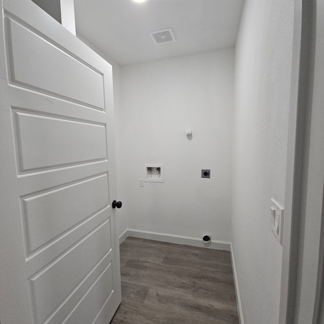 clothes washing area featuring hookup for an electric dryer, dark hardwood / wood-style flooring, and washer hookup