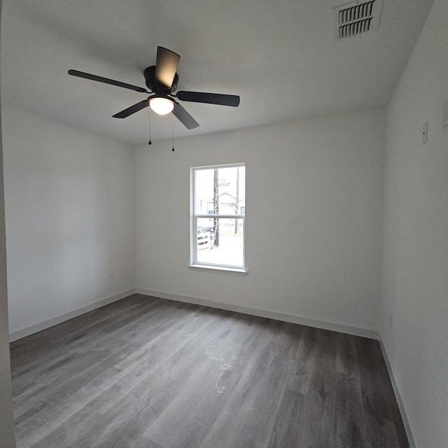 spare room featuring ceiling fan and wood-type flooring