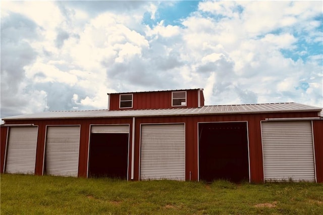 garage featuring a yard