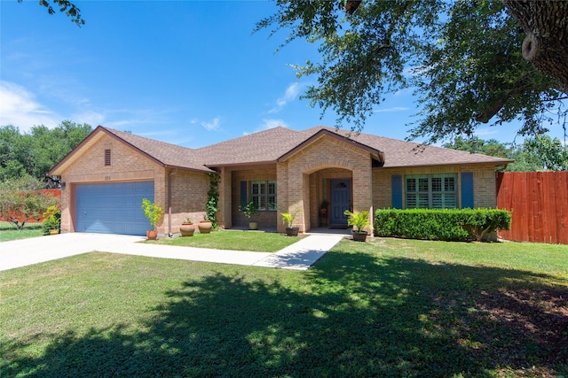 ranch-style home with a front lawn and a garage